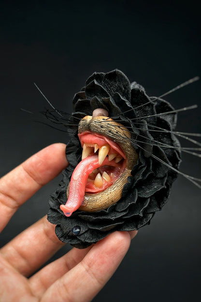 Handmade polymer clay Black Flower With Animal Teeth, a unique wearable art piece by ioArtStudio