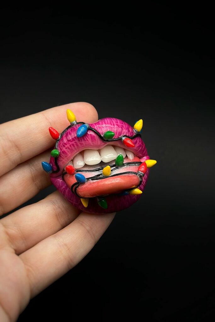 lips with christmas light bulbs around it , Handmade with polymer clay Wearable Artwork by ioArtStudio