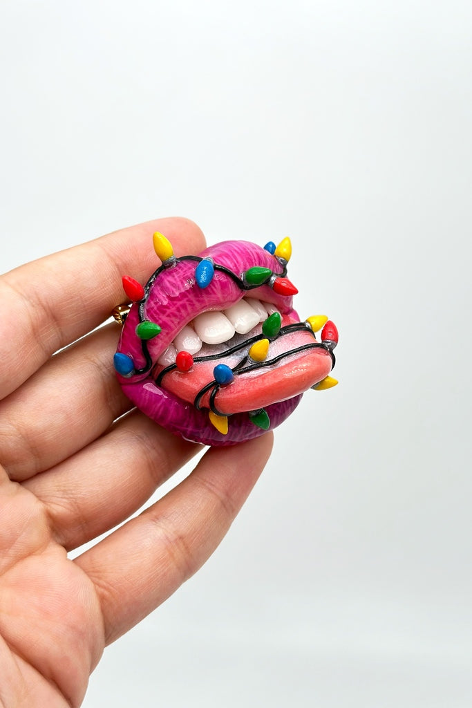 lips with christmas light bulbs around it , Handmade with polymer clay Wearable Artwork by ioArtStudio