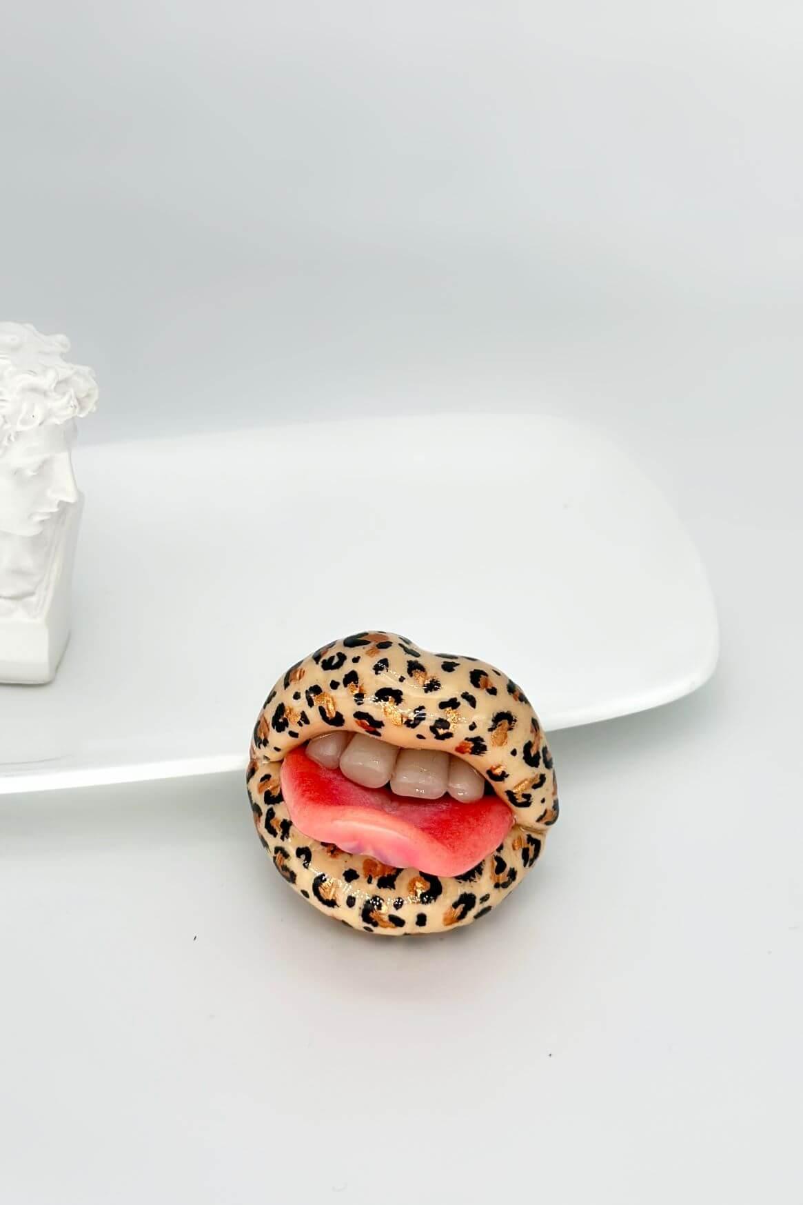 Handmade leopard print lips with tongue hand sculpted by Polymer Clay, a fun and stylish accessory by ioArtStudio