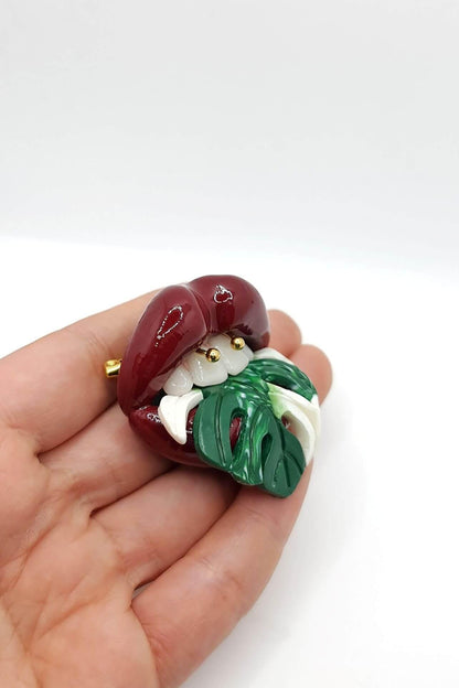 Monstera Albo Plant with Maroon Red Lips Handcrafted from Polymer Clay and Resin -A One-of-a-Kind, Attention-Grabbing Wearable Artwork by ioArtStudio