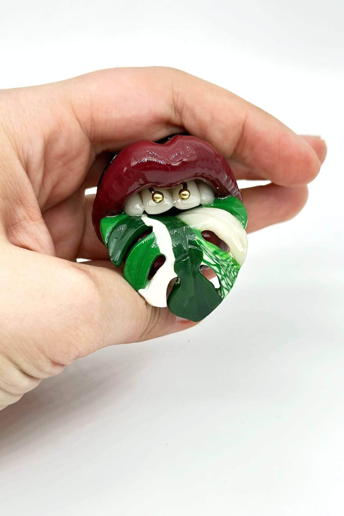 Monstera Albo Plant with Maroon Red Lips Handcrafted from Polymer Clay and Resin -A One-of-a-Kind, Attention-Grabbing Wearable Artwork by ioArtStudio