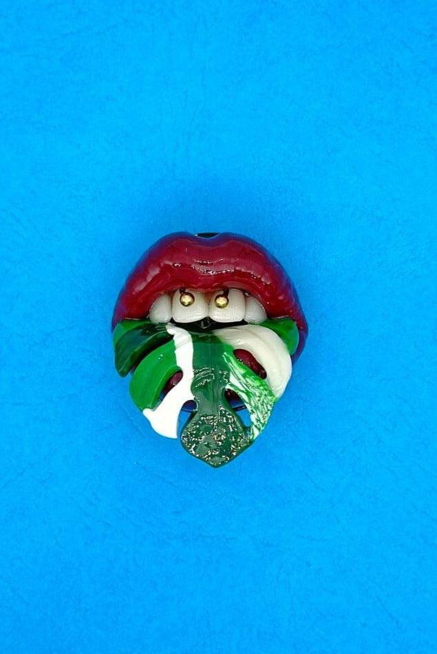 Monstera Albo Plant with Maroon Red Lips Handcrafted from Polymer Clay and Resin -A One-of-a-Kind, Attention-Grabbing Wearable Artwork by ioArtStudio