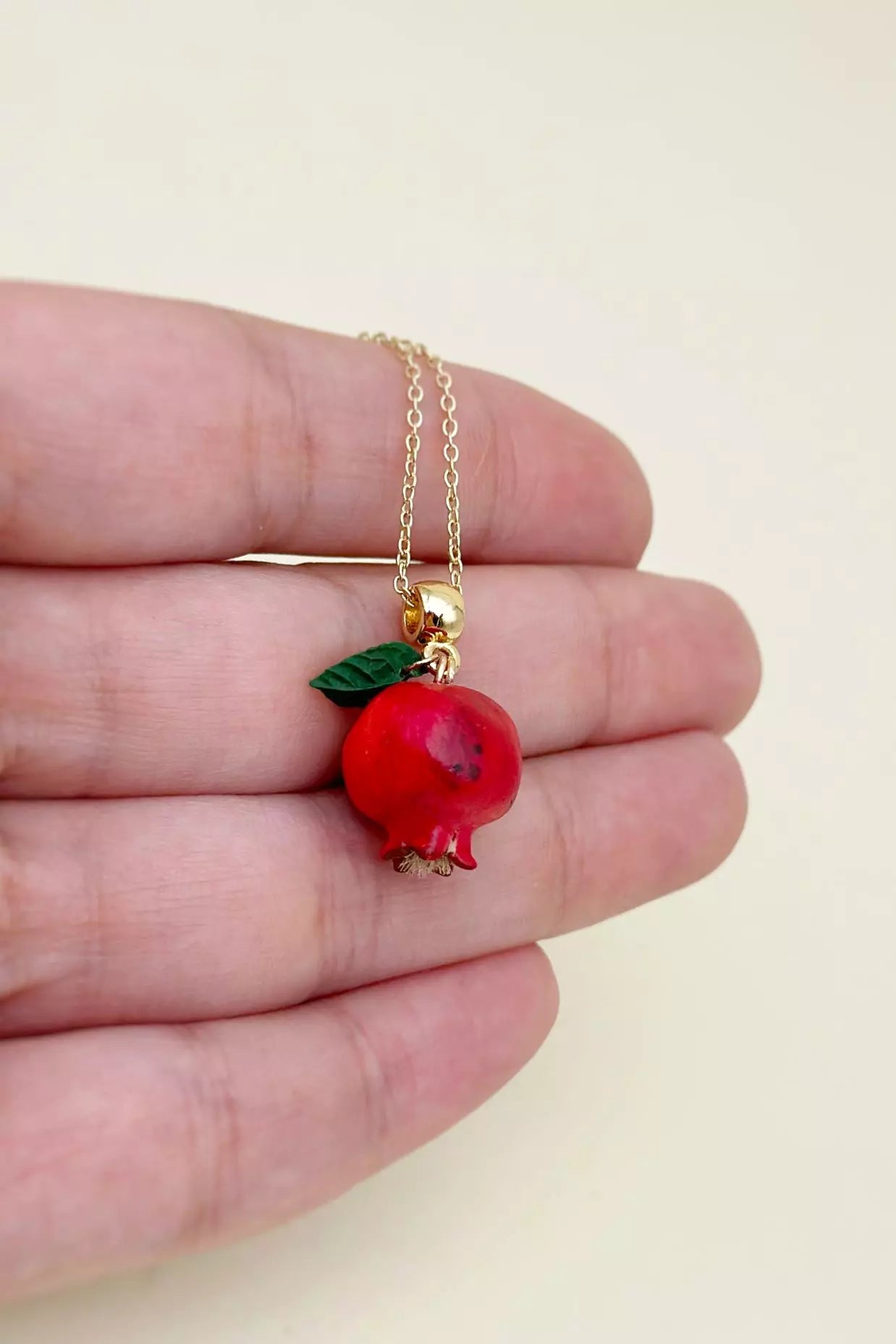 Handcrafted polymer clay Pomegranate Necklace, featuring intricate details for a unique, natural-inspired accessory made by ioArtStudio