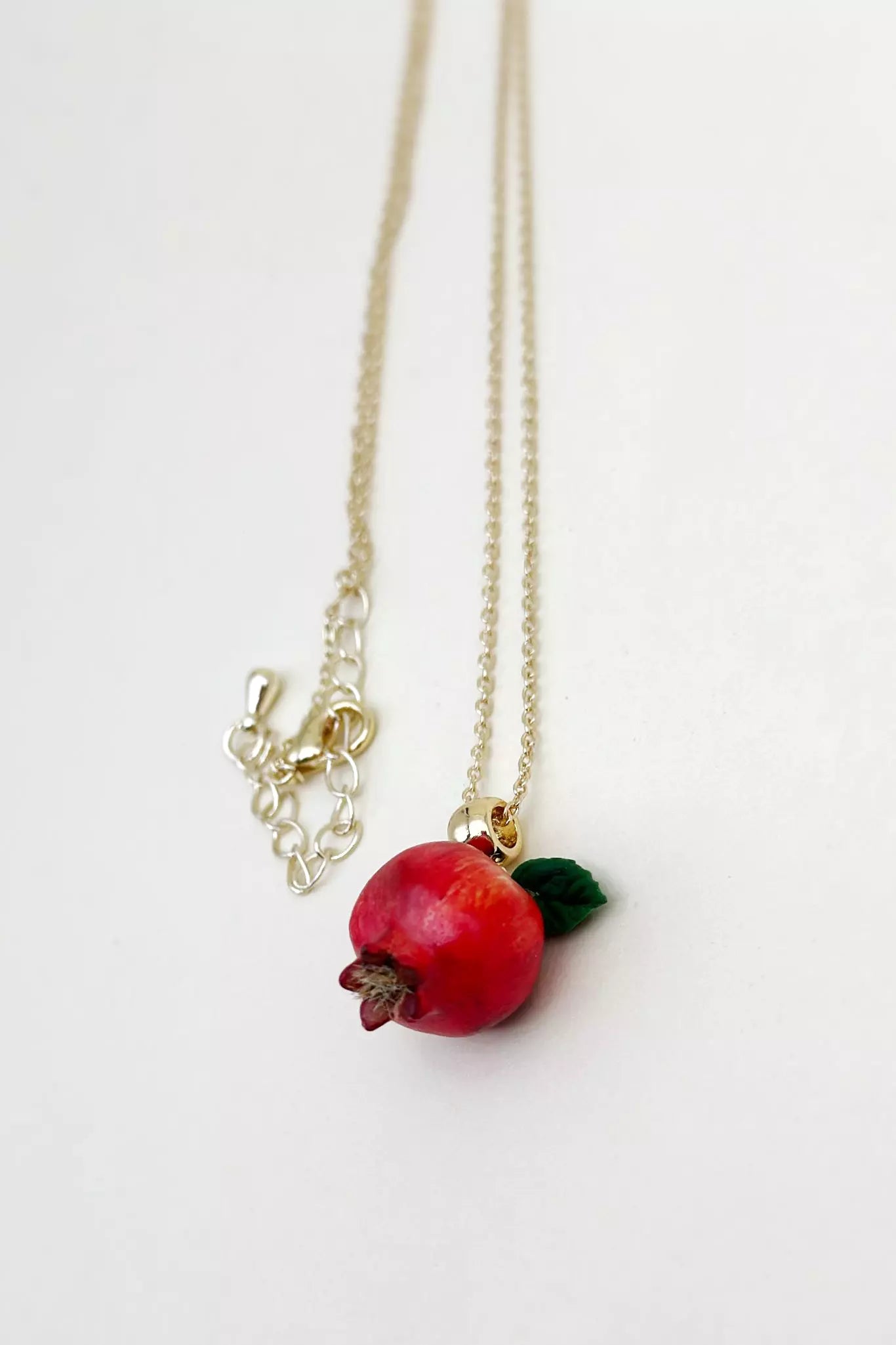 Handcrafted polymer clay Pomegranate Necklace, featuring intricate details for a unique, natural-inspired accessory made by ioArtStudio