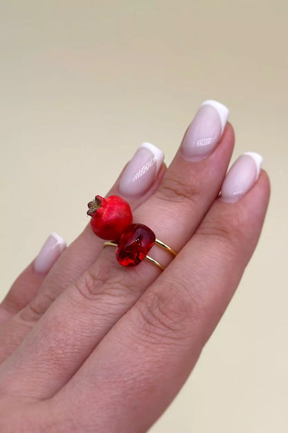 Pomegranate Rings Set featuring one ring with a pomegranate seed and another with a whole pomegranate by ioArtStudio