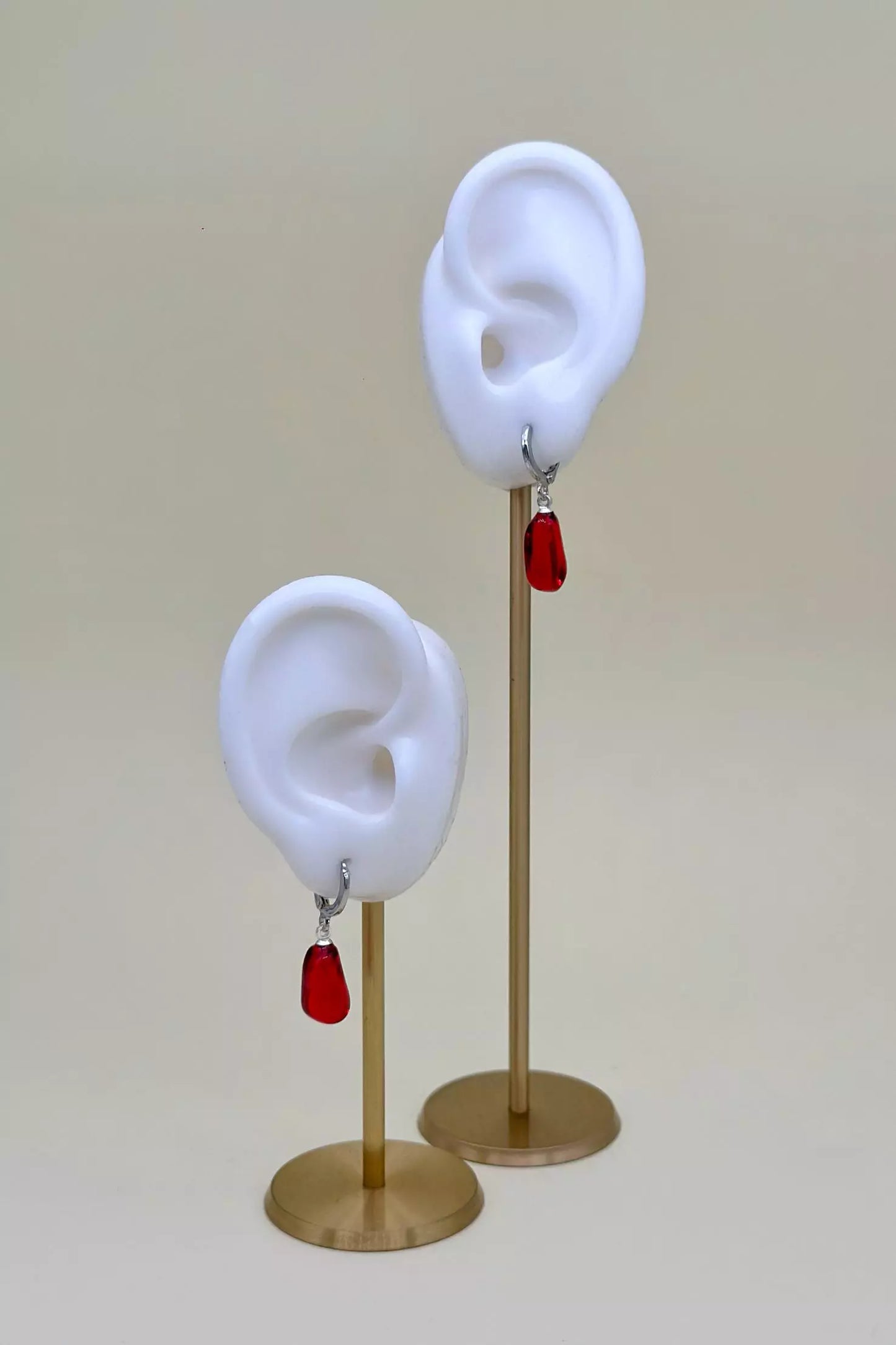 Pomegranates Leverback Earrings Set: one earring is an epoxy seed, and the other is a polymer clay whole pomegranate, with leverbacks