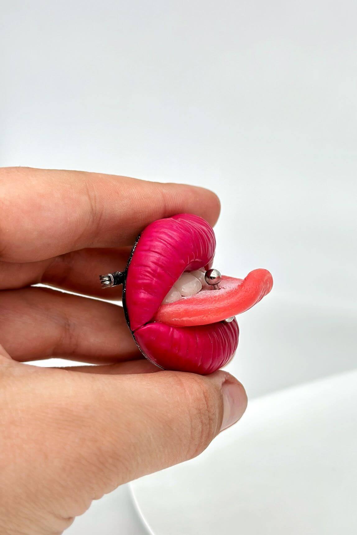 Reddish pink lips with  tongue ring, Hand sculpted by polymer clay, a unique and eye-catching wearable art.