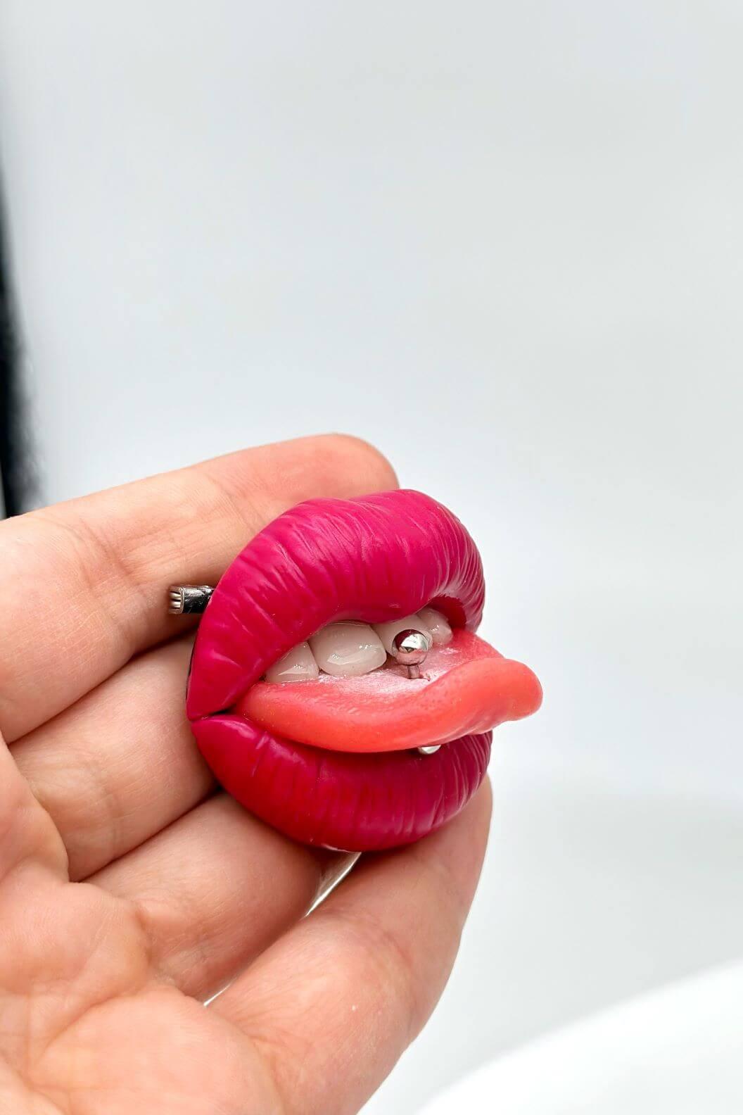 Reddish pink lips with  tongue ring, Hand sculpted by polymer clay, a unique and eye-catching wearable art.