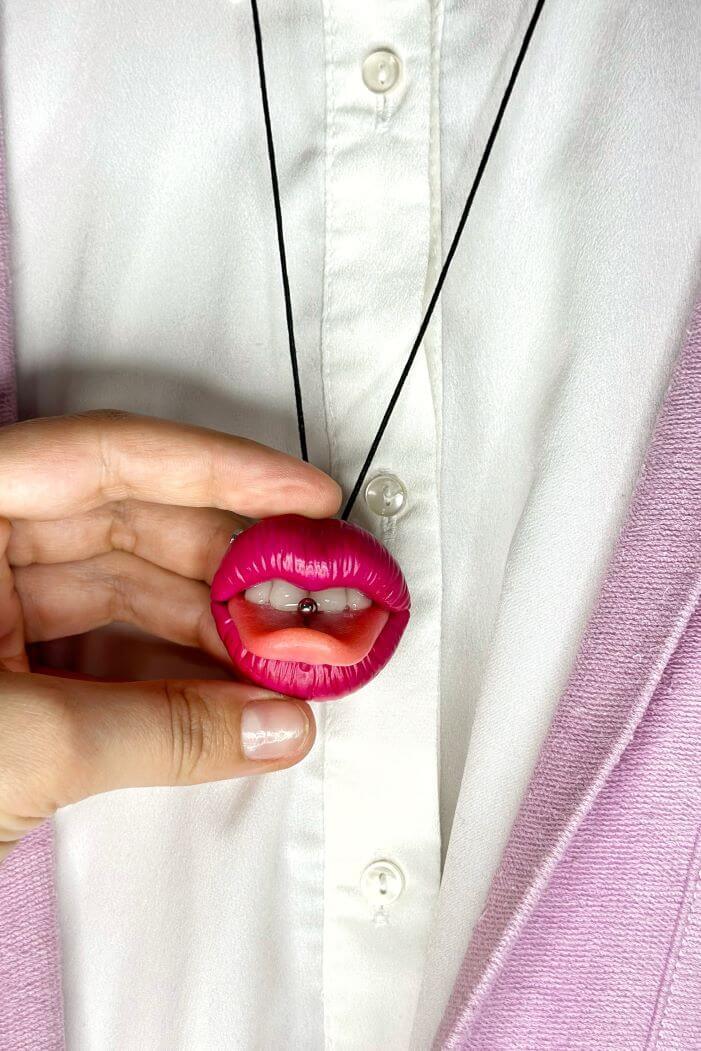 Reddish pink lips with  tongue ring, Hand sculpted by polymer clay, a unique and eye-catching wearable art.