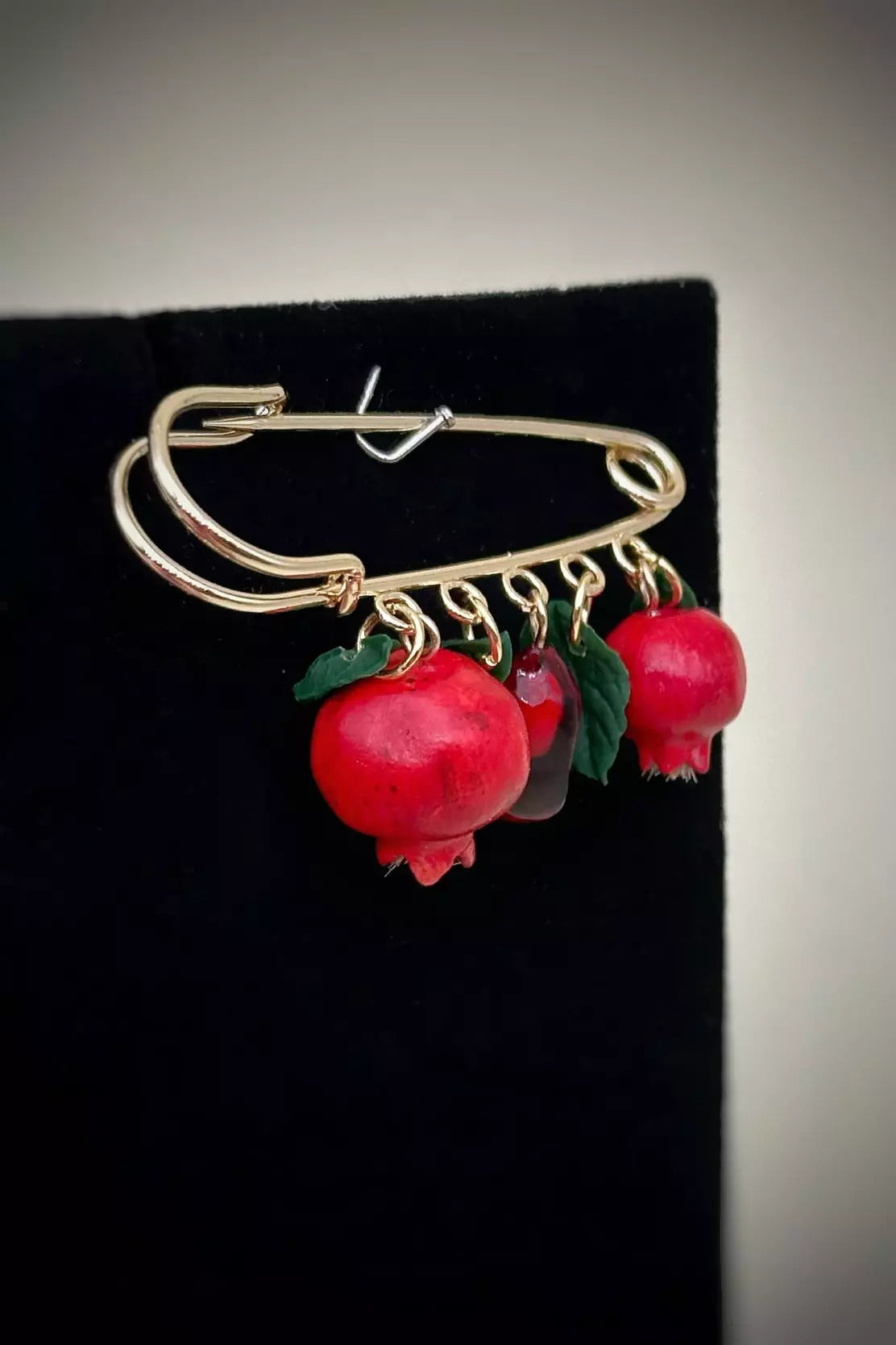 Safety Pin Pomegranate  handmade  wearable art piece, crafted from polymer clay and epoxy resin  by ioArtStudio