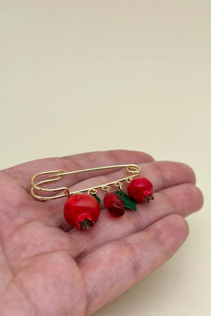 Safety Pin Pomegranate  handmade  wearable art piece, crafted from polymer clay and epoxy resin  by ioArtStudio