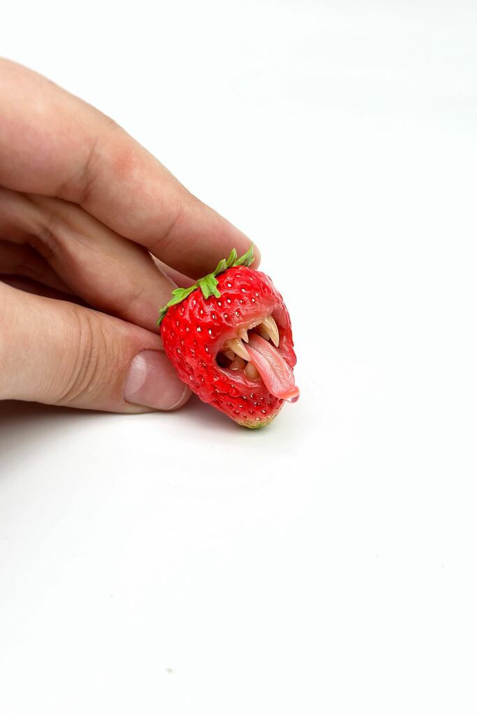 Strawberry Adjustable Ring With Tiger Teeth sculpted with polymer clay. A unique and eye-catching wearable art by ioArtStudio