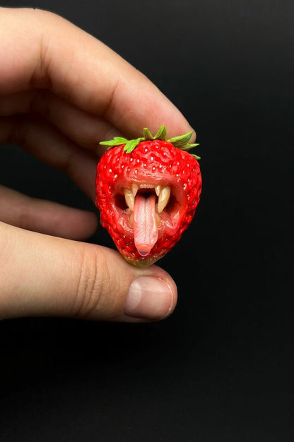 Strawberry Adjustable Ring With Tiger Teeth sculpted with polymer clay. A unique and eye-catching wearable art by ioArtStudio