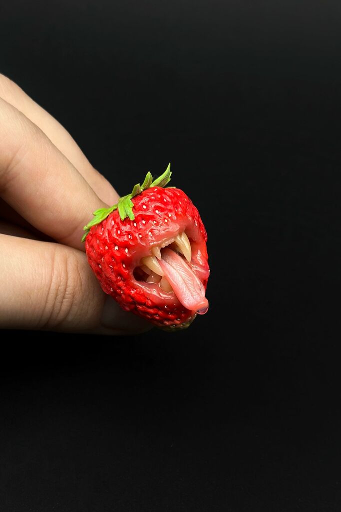 Strawberry Adjustable Ring With Tiger Teeth sculpted with polymer clay. A unique and eye-catching wearable art by ioArtStudio