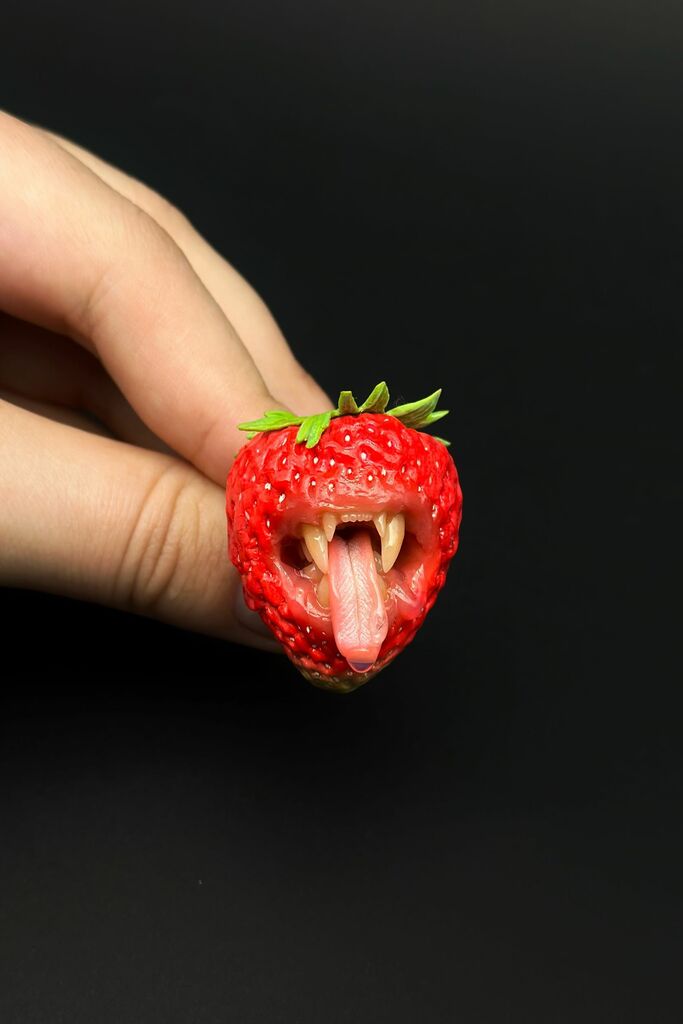 Strawberry Adjustable Ring With Tiger Teeth sculpted with polymer clay. A unique and eye-catching wearable art by ioArtStudio