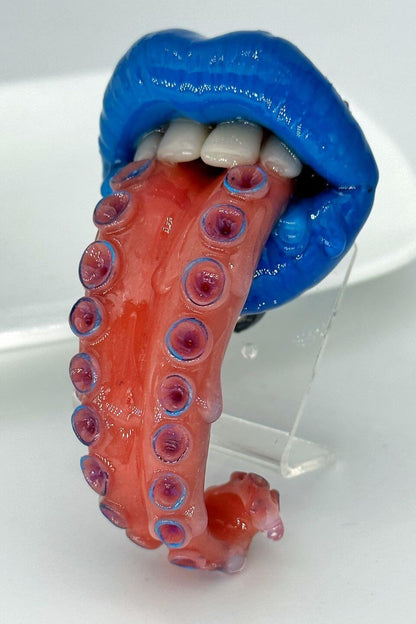 Tentacle tongue with blue lips hand-sculpted wearable art piece, crafted from polymer clay  by ioArtStudio