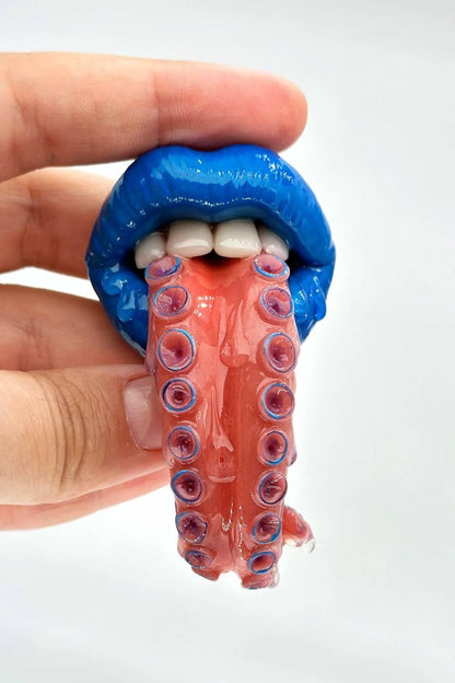 Tentacle tongue with blue lips hand-sculpted wearable art piece, crafted from polymer clay  by ioArtStudio