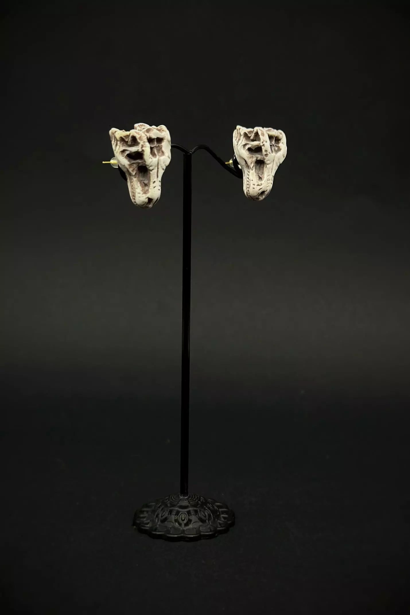 Trex Head Earrings in stud or dangle variations, featuring realistic dinosaur skull and skeleton designs by ioArtStudio