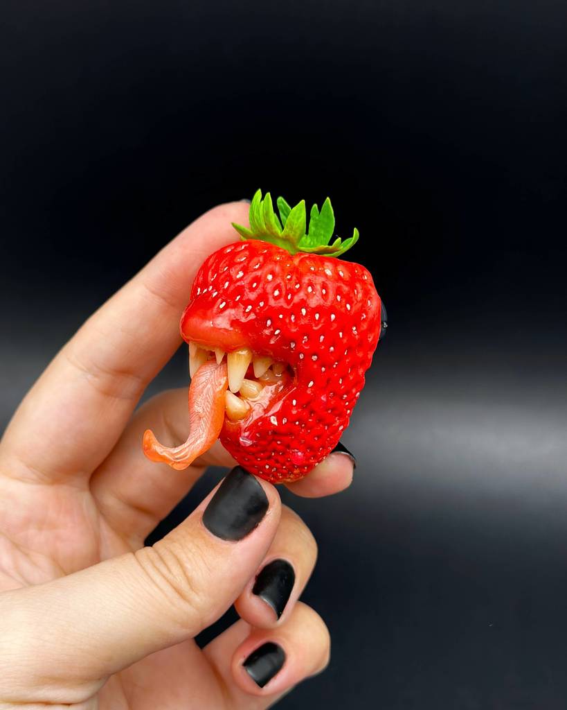 Wild Strawberry With Tiger Teeth sculpted with polymer clay. A unique and eye-catching wearable art by ioArtStudio